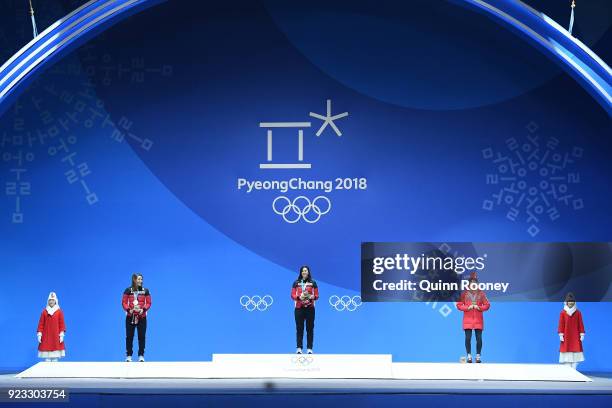Silver medalist Brittany Phelan of Canada, gold medalist Kelsey Serwa of Canada and bronze medalist Fanny Smith of Switzerland stand on the podium...