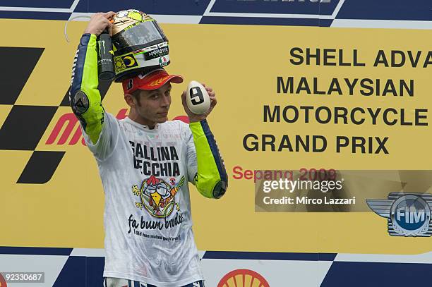 Valentino Rossi of Italy and Fiat Yamaha celebrates winning his ninth MotoGP World Championship title with his third place in the Malaysian MotoGP of...