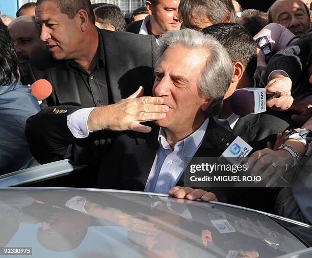 Uruguayan President Tabare Vazquez greets supportes after casting his vote during general election day, in Montevideo on October 25, 2009. Uruguayans...