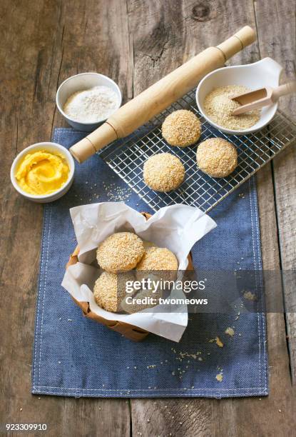 chinese food snack sesame seed biscuit on wooden table top. - sesame stock pictures, royalty-free photos & images