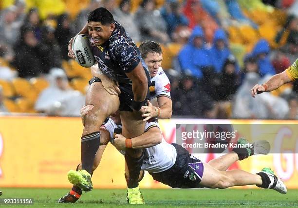 Jason Taumalolo of the Cowboys attempts to break away from the defence during the NRL trial match and Jonathan Thurston/Cameron Smith Testimonial...
