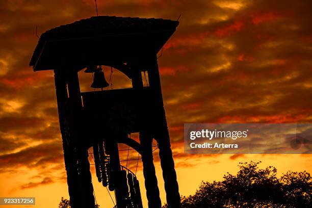 Wooden belltower of the Jesuit Church of the Missions silhouetted against sunset at Concepcion, Nuflo de Chavez, Santa Cruz, Bolivia.