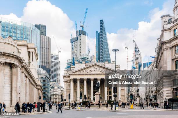 street in city of london with royal exchange, bank of england and new modern skyscrapers, england, uk - bank building stockfoto's en -beelden