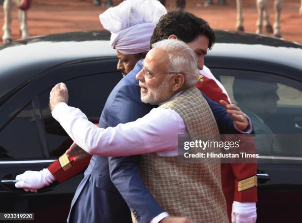 Canadian Prime Minister Justin Trudeau hugs PM Narendra Modi at the ceremonial reception at Rashtrapati Bhawan on February 23, 2018 in New Delhi,...