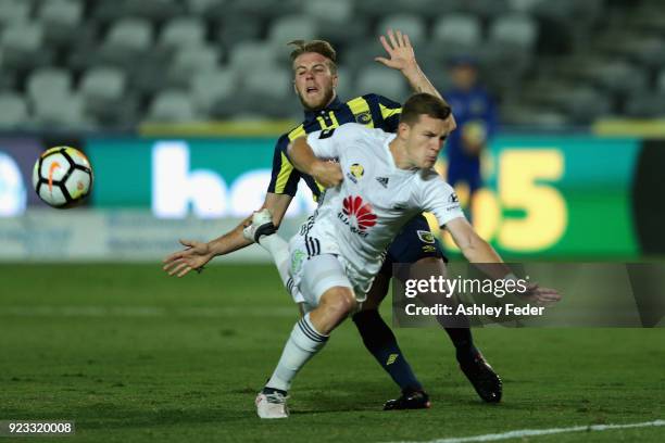 Scott Galloway of the Phoenix contests the ball against Andrew Hoole of the Mariners during the round 21 A-League match between the Central Coast...