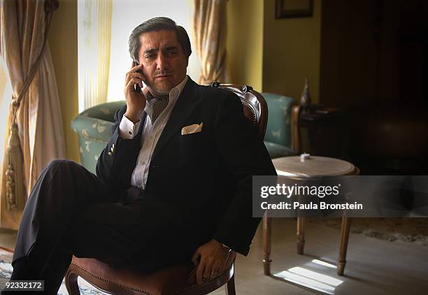 Top presidential challenger Abdullah Abdullah talks on the phone inside his Kabul home October 25, 2009 in Kabul, Afghanistan. Abdullah Abdullah and...