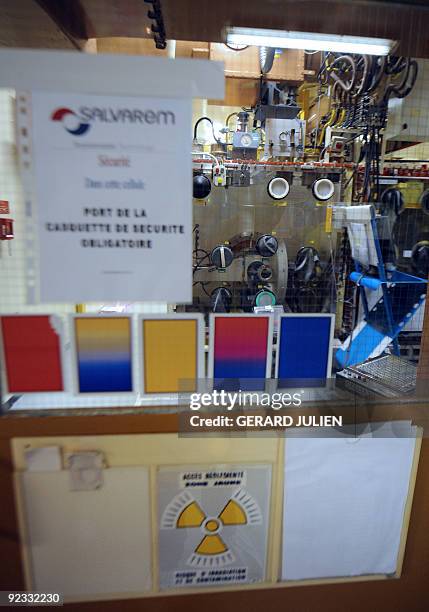 Picture of a "boite à gants" cell at the "atelier de technologie du plutonium" at the Cadarache nuclear research centre taken on October 15, 2009 in...