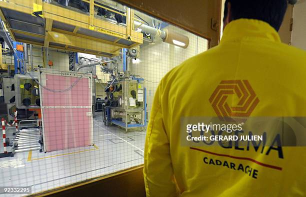 Technician of the French Atomic Energy Commission stands in the "atelier de technologie du plutonium" at the Cadarache nuclear research centre on...