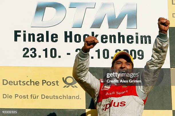 Audi driver Timo Scheider of Germany celebrates after winning the overall competition of the DTM 2009 German Touring Car Championship at the...