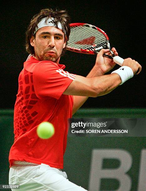 Marcos Baghdatis of Cyprus returns the ball to Olivier Rochus of Belgium on October 25, 2009 in the final of the Stockholm Open in the Swedish...