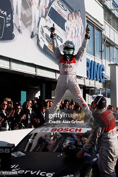 Audi driver Timo Scheider of Germany celebrates after winning the overall competition of the DTM 2009 German Touring Car Championship at the...