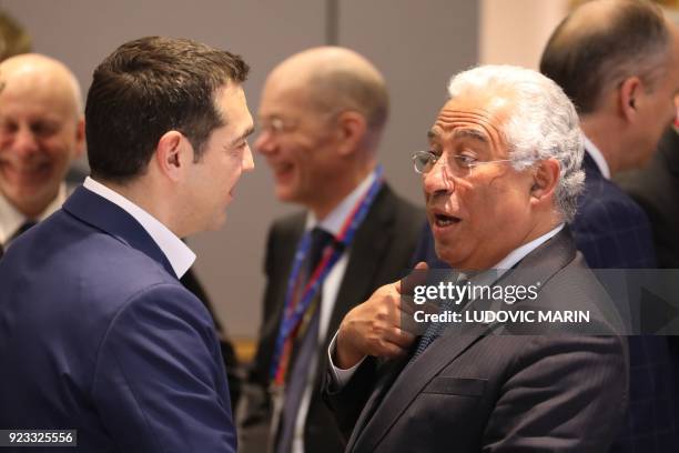 Greece's Prime Minister Alexis Tsipras and Portugal 's Prime Minister Antonio Costa speak as they attend an informal meeting of the 27 EU heads of...