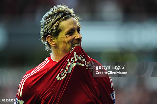 Fernando Torres of Liverpool celebrates scoring the opening goal during the Barclays Premier League match between Liverpool and Manchester United at...