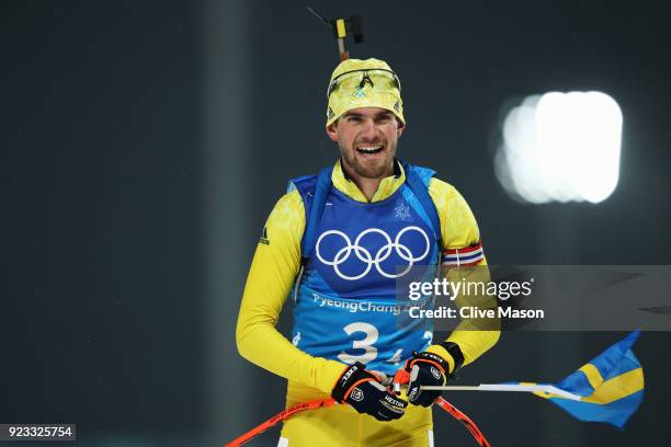 Fredrik Lindstroem of Sweden celebrates winning the gold medal during the Men's 4x7.5km Biathlon Relay on day 14 of the PyeongChang 2018 Winter...
