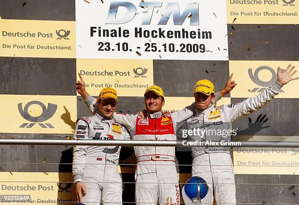 Audi driver Timo Scheider of Germany celebrates after winning the overall competition of the DTM 2009 German Touring Car Championship at the...