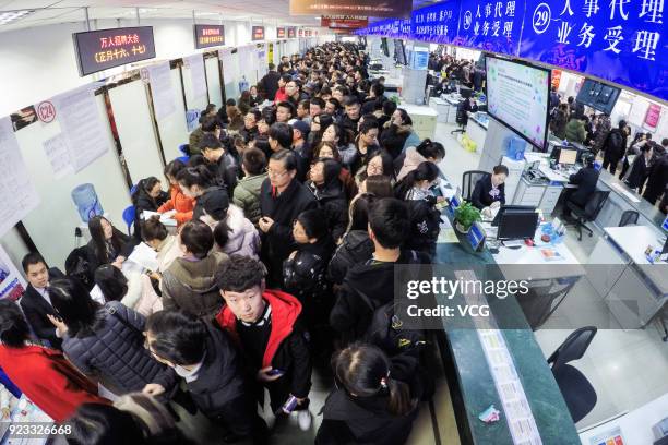 Job seekers crowd to a job fair on February 23, 2018 in Taiyuan, Shanxi Province of China. Companies showcase their job offerings for job seekers in...