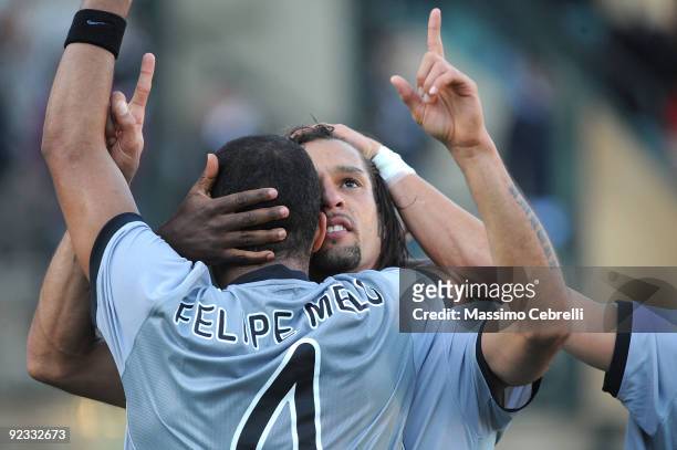 Amauri of Juventus FC celebrates his first goal with teammate Felipe Meloduring the Serie A match between AC Siena and Juventus FC at Artemio Franchi...