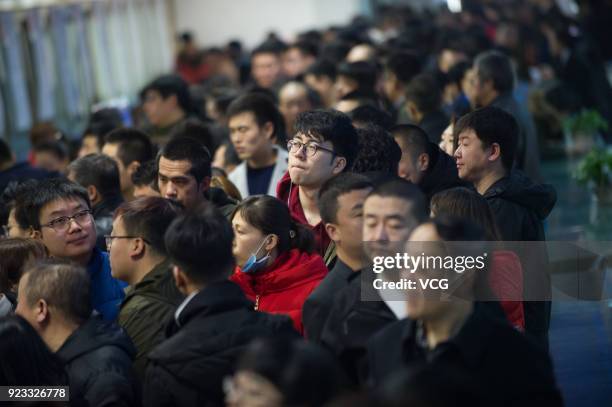 Job seekers crowd to a job fair on February 23, 2018 in Taiyuan, Shanxi Province of China. Companies showcase their job offerings for job seekers in...