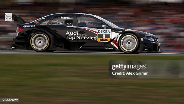 Audi driver Timo Scheider of Germany steers his car during the final run of the DTM 2009 German Touring Car Championship at the Hockenheim race track...