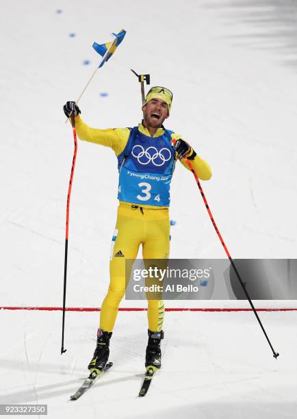 Fredrik Lindstroem of Sweden celebrates as his country win the gold medal during the Men's 4x7.5km Biathlon Relay on day 14 of the PyeongChang 2018...