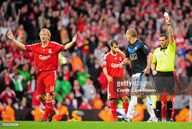 Nemanja Vidic of Manchester United is sent off by Referee Andre Marriner after fouling Dirk Kuyt of Liverpool during the Barclays Premier League...