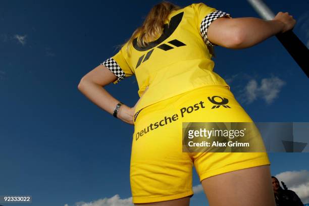 Grid girl waits for the start of the final run of the DTM 2009 German Touring Car Championship at the Hockenheim race track on October 25, 2009 in...