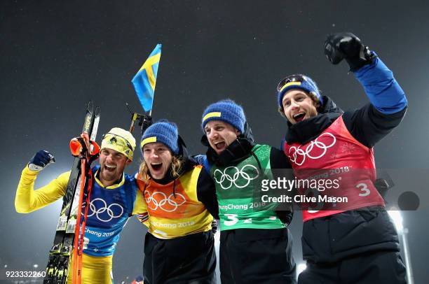 Fredrik Lindstroem, Sebastian Samuelsson, Jesper Nelin and Peppe Femling of Sweden celebrate winning the gold medal during the Men's 4x7.5km Biathlon...