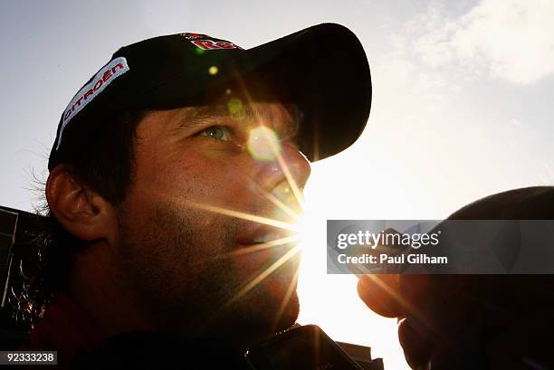 Sebastien Loeb of France and Citroen Total WRT talks to the media after winning the World Championship and the Wales Rally GB at Cardiff Bay on...