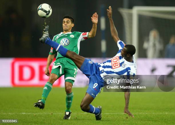 Josue of Wolfsburg battles for the ball with Adrian Ramos of Berlin during the Bundesliga match between Hertha BSC Berlin and VFL Wolfsburg at...