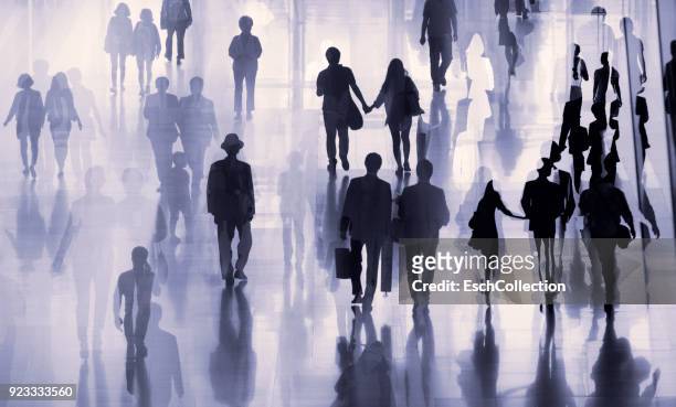 multiple exposure image of people walking in a city - seguir actividad móvil general fotografías e imágenes de stock