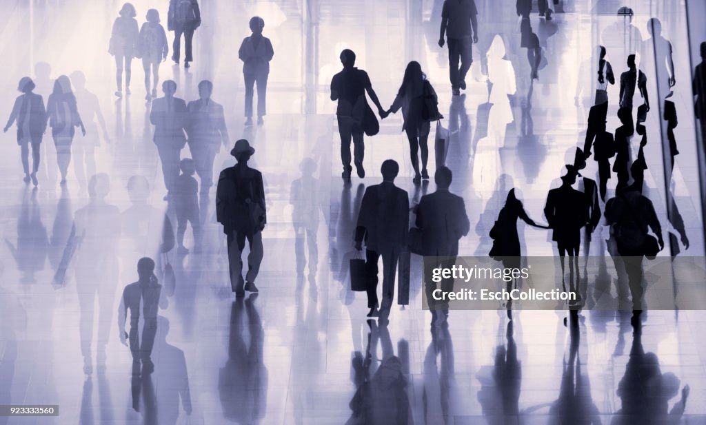 Multiple exposure image of people walking in a city