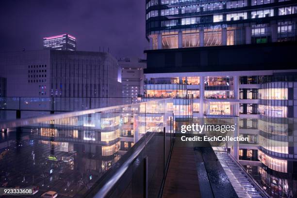 illuminated office buildings and shopping mall in osaka, japan - sky low angle view stock pictures, royalty-free photos & images