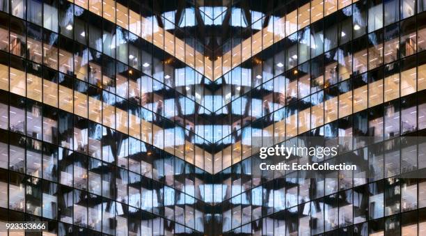 reflections in glass office facade at dusk - double fotografías e imágenes de stock