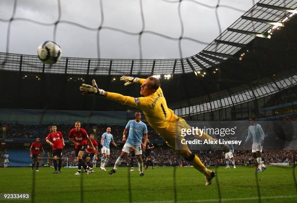 Martin Petrov of Manchester City scores the second goal past Mark Schwarzer of Fulham during the Barclays Premier League match between Manchester...