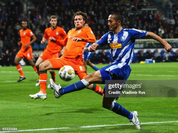 Shinji Ono of Bochum attacks as Clemens Fritz of Bremen defends during the Bundesliga match between VfL Bochum and SV Werder Bremen at Rewirpower...