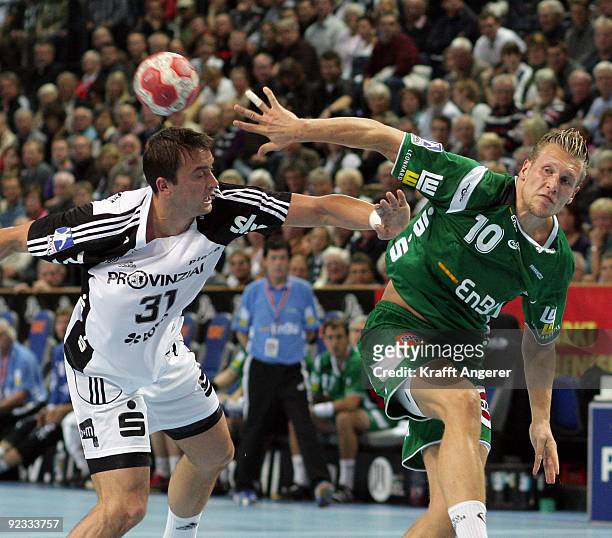 Momir ilic of Kiel challenges for the ball with Lars Kaufmann of Goeppingen during the Toyota Handball Bundesliga match between THW Kiel and Frisch...