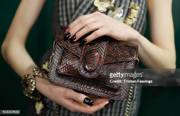 Model, bag detail, walks the runway at the Antonio Marras show during Milan Fashion Week Fall/Winter 2018/19 on February 23, 2018 in Milan, Italy.