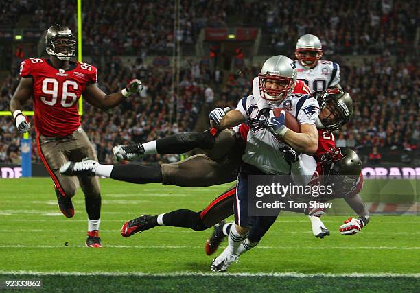 Wes Welker of the New England Patriots goes over for the second touchdown during the NFL International Series match between New England Patriots and...