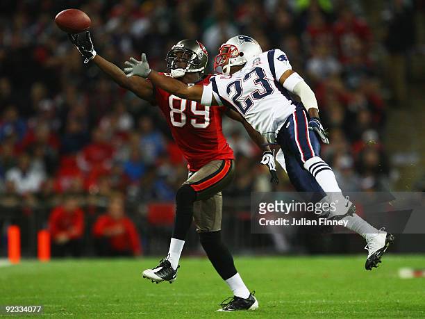 Antonio Bryant of Tampa Bay Buccaneers and Leigh Bodden of the New England Patriots compete for the ball during the NFL International Series match...