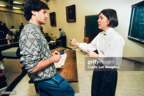 American academic Professor Elizabeth Warren speaks with an unidentified student in a lecture hall after class at University of Pennsylvania Law...