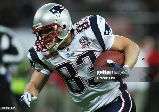 Wes Welker of the New England Patriots runs with the ball during the NFL International Series match between New England Patriots and Tampa Bay...