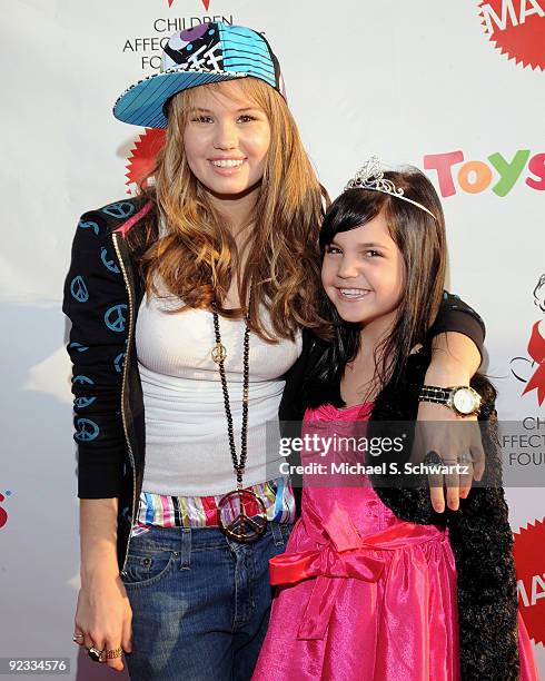 Actress Debby Ryan and actress Bailee Madison attend the CAAF Dream Halloween Fundraiser at the Barker Hanger on October 24, 2009 in Santa Monica,...