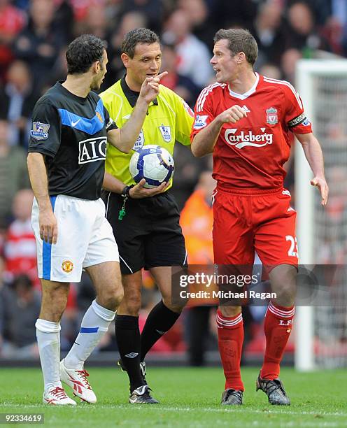 Jamie Carragher of Liverpool and Ryan Giggs of Manchester United have words with Referee Andre Marriner during the Barclays Premier League match...