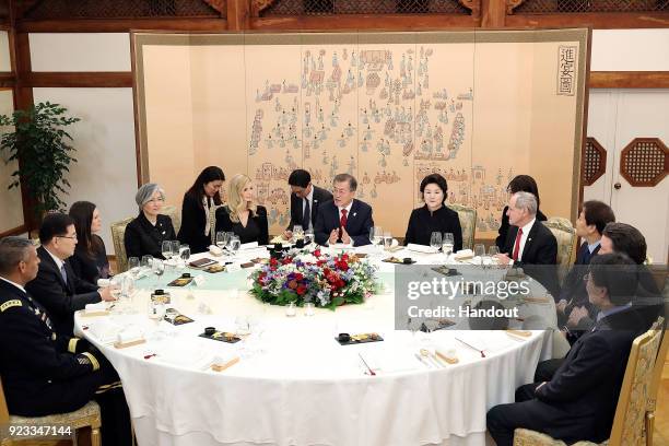 In this handout image provided by the South Korean Presidential Blue House, South Korean President Moon Jae-In talks with Ivanka Trump during their...