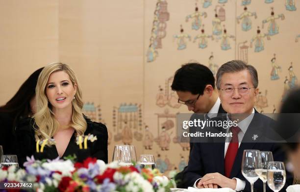 In this handout image provided by the South Korean Presidential Blue House, South Korean President Moon Jae-In talks with Ivanka Trump during their...