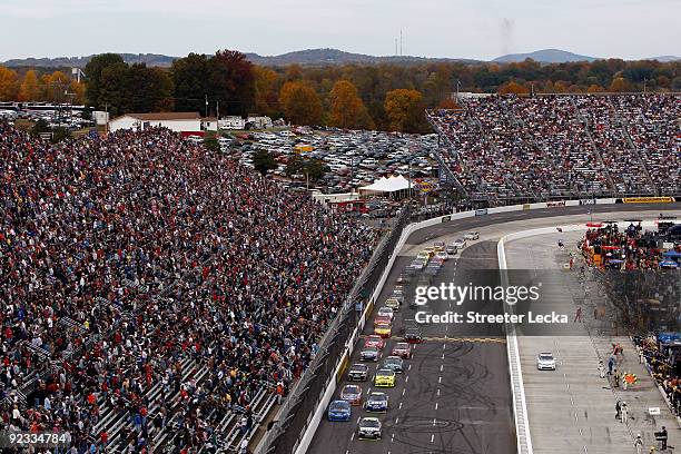 Martin Truex Jr., driver of the Vaseline MEN Body Lotion Chevrolet, and Jeff Gordon, driver of the DuPont/NationalGuard.com Chevrolet, lead the field...