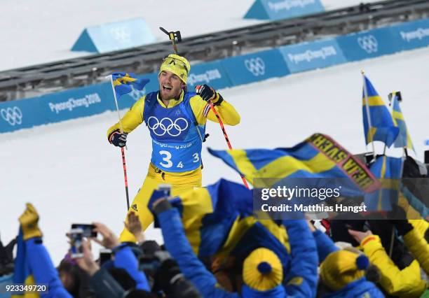 Fredrik Lindstroem of Sweden heads along the finish straight on the way to winning the gold medal during the Men's 4x7.5km Biathlon Relay on day 14...