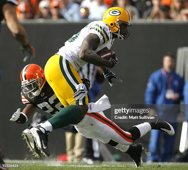 Donald Lee of the Green Bay Packers is hit by Brandon McDonald of the Cleveland Browns at Cleveland Browns Stadium on October 25, 2009 in Cleveland,...