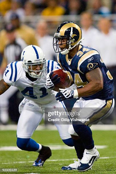 Kenneth Darby of the St. Louis Rams looks to get past Antoine Bethea the Indianapolis Colts at the Edward Jones Dome on October 25, 2009 in St....