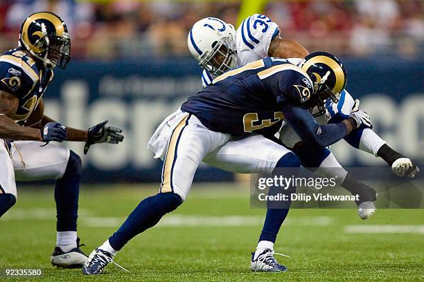 Chad Simpson of the Indianapolis Colts is tackled by James Butler the St. Louis Rams at the Edward Jones Dome on October 25, 2009 in St. Louis,...